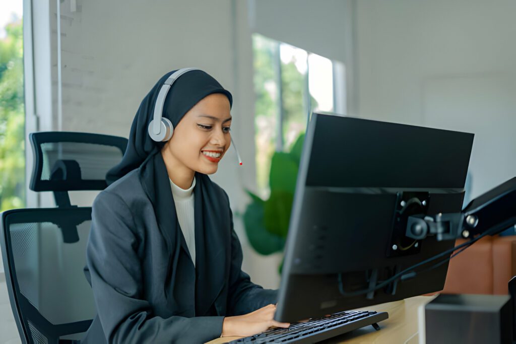 Islamic woman In Hijab And Headset Having Video Call in Customer Service Job with CompTIA A+